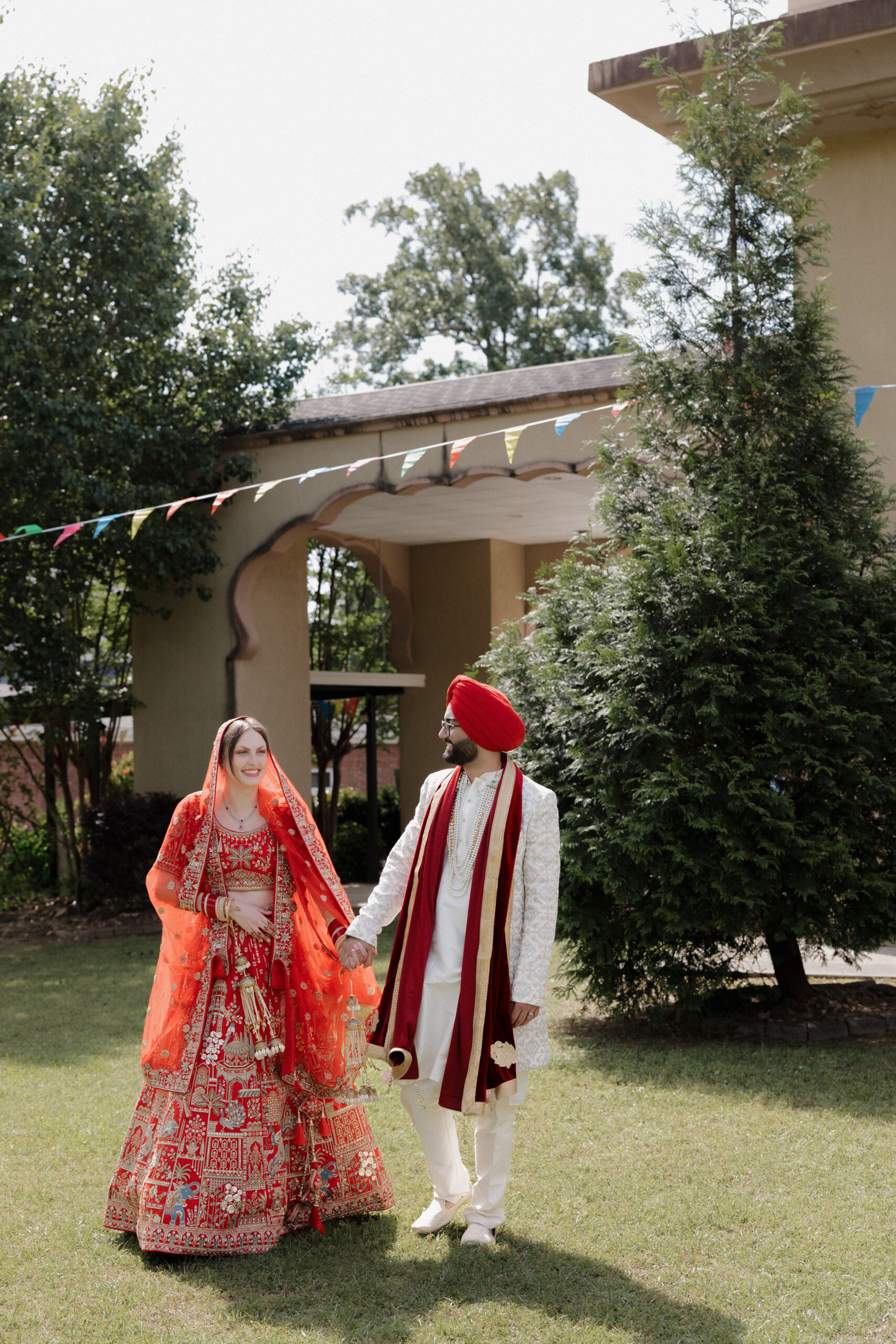 A bride & groom take a walk after their ceremony at the Gurdwara Guru Nanaksar in Columbia, South Carolina.