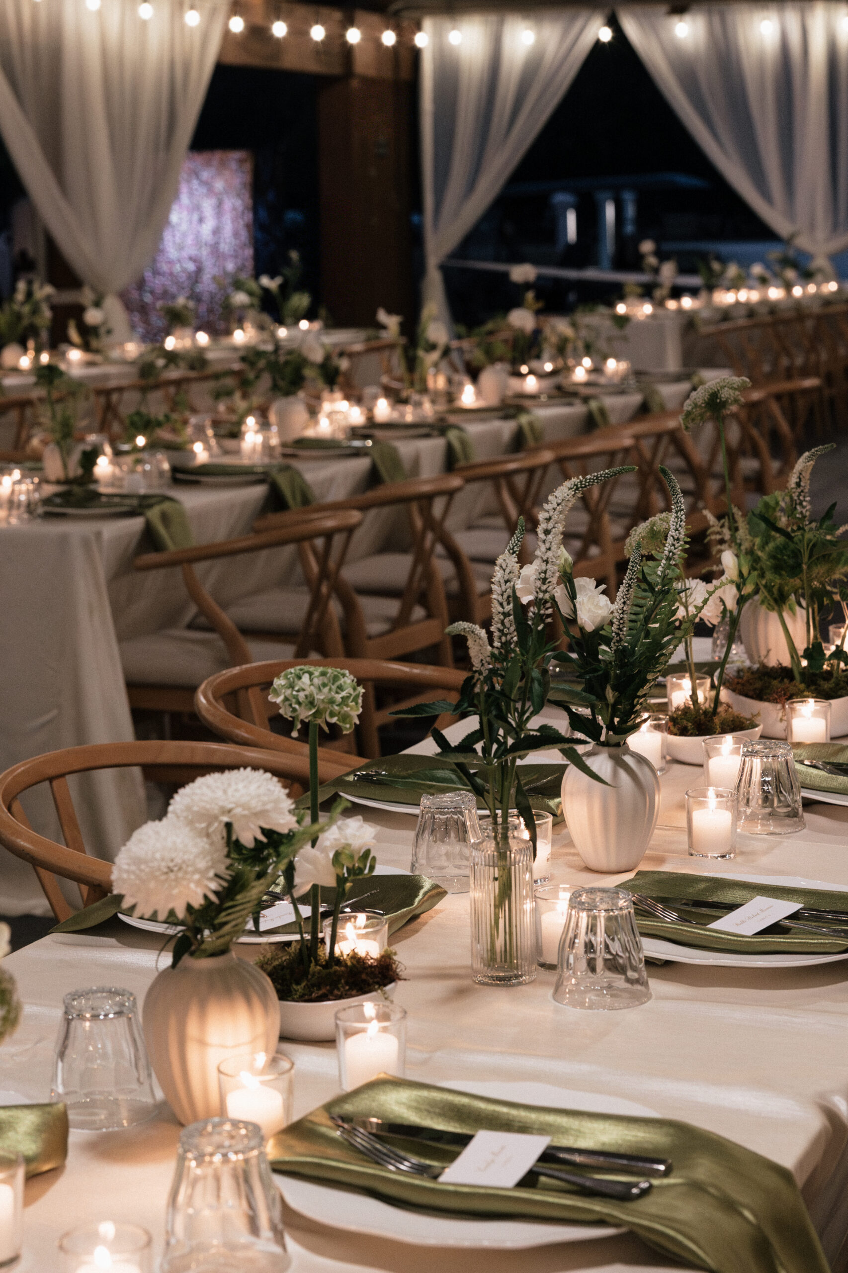 Details of a table scape at the Coastal Discovery Museum in Hilton Head, South Carolina on a wedding day. Chartreuse and white florals line the table in unique arrangements.